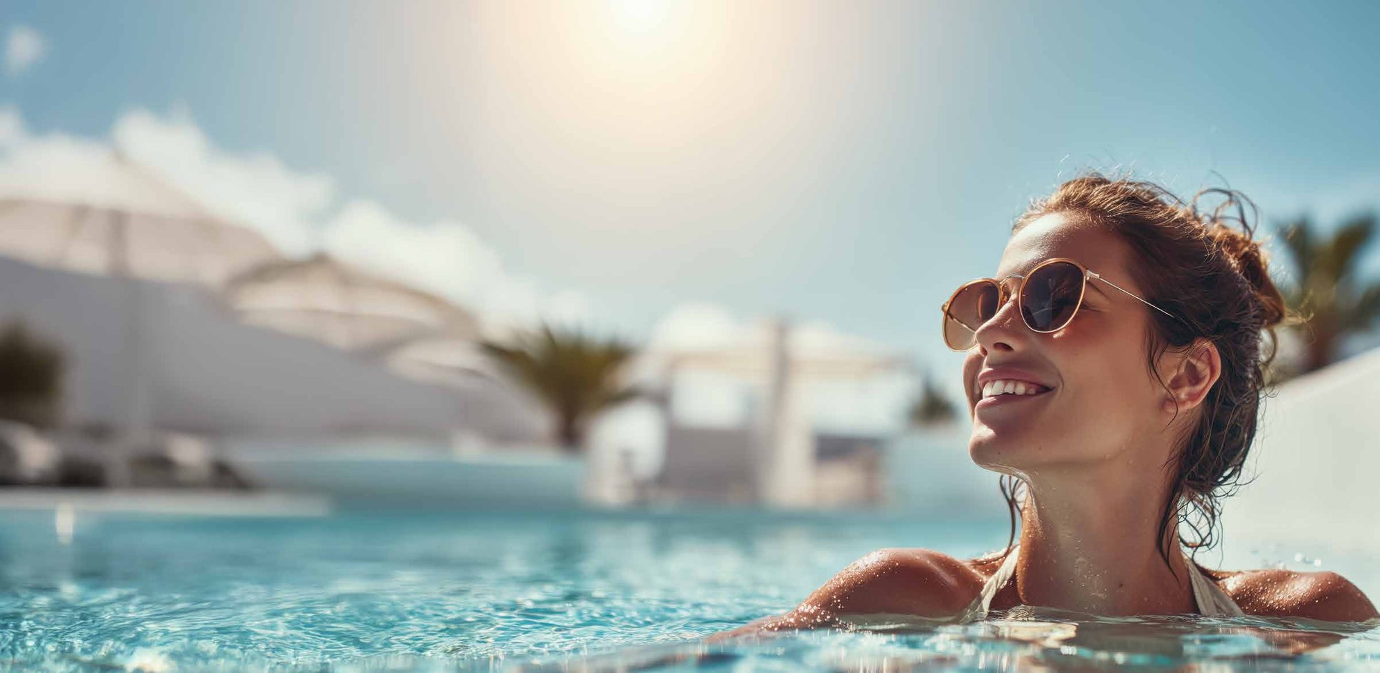 Resident relaxing in the rooftop pool at a DAMAC community